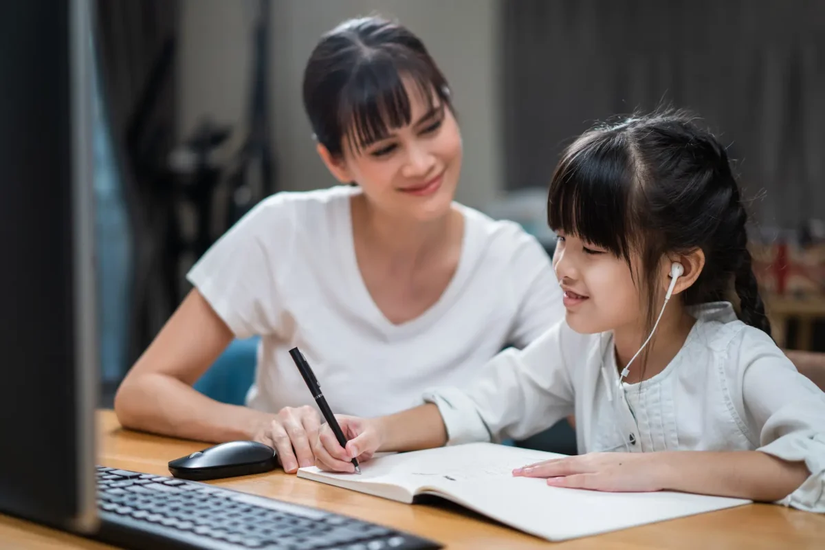 mother working with her daughter's language proficiency.